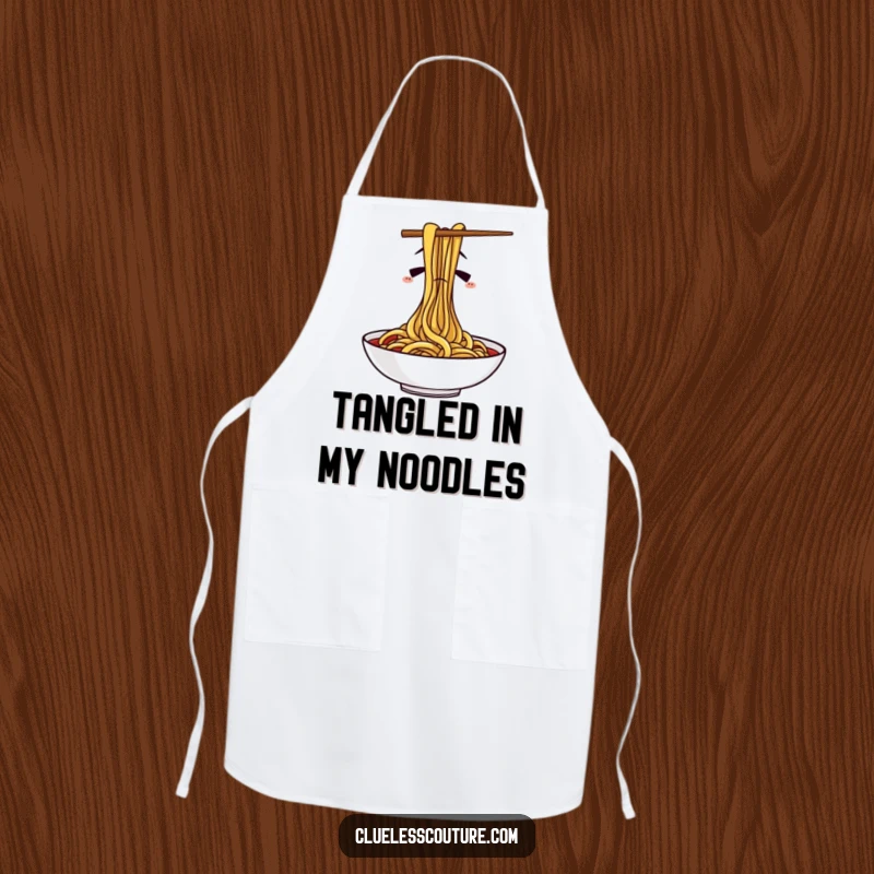 Funny apron featuring confused chopsticks hilariously trying to eat spaghetti, perfect for adding humor to cooking and baking.