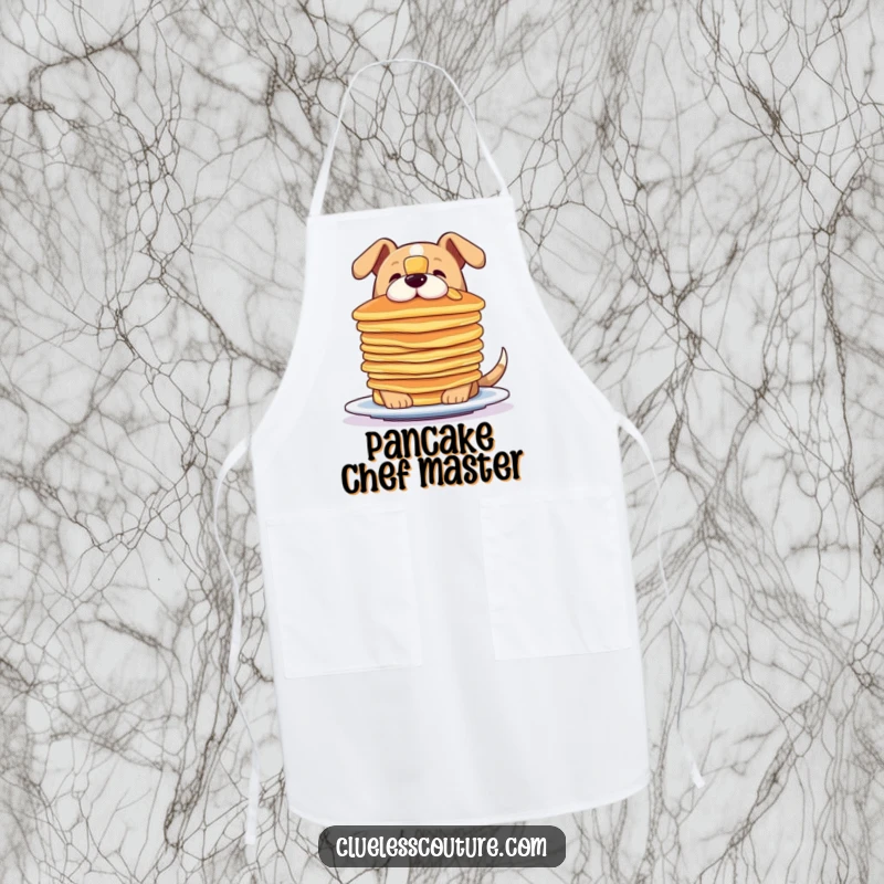 Funny apron featuring a dog attempting to balance a stack of pancakes on its nose, ideal for kitchen fun.
