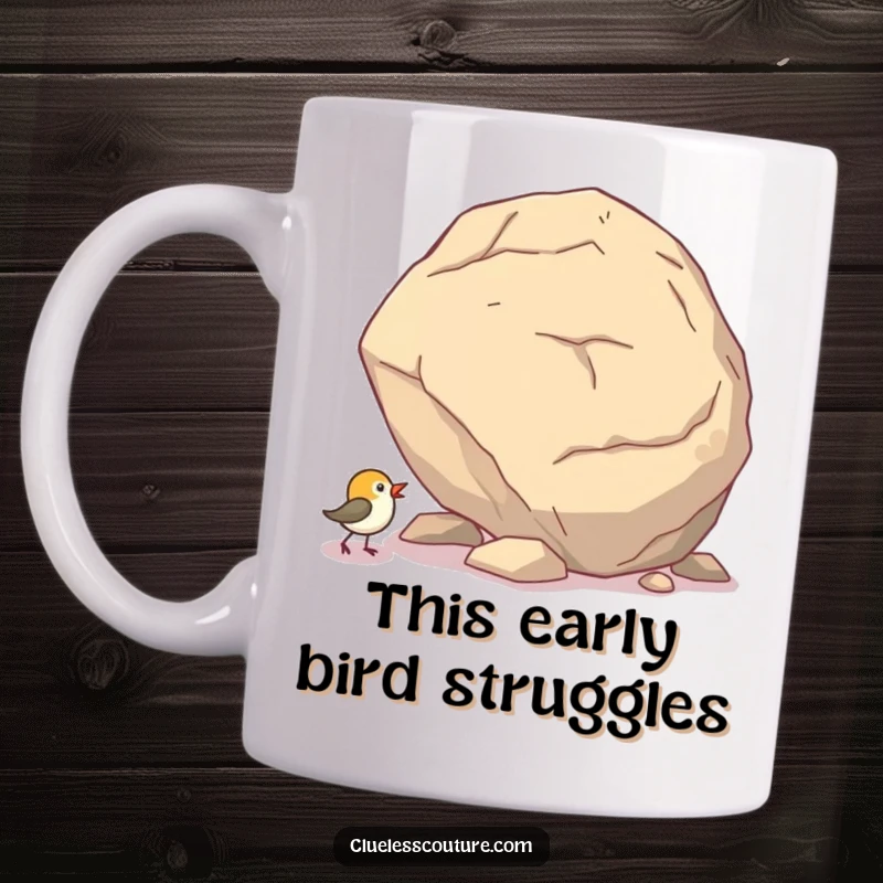 Funny mug showing a tiny bird comically trying to push a gigantic boulder up a steep hill.
