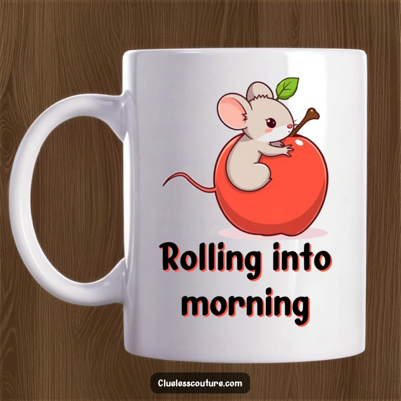 Funny mug showing a tiny mouse accidentally riding a runaway, large, rolling apple downhill, looking surprised and thrilled.
