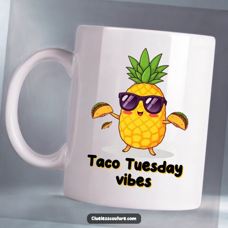 Funny pineapple wearing sunglasses juggling three tiny tacos on a mug, capturing party vibes.