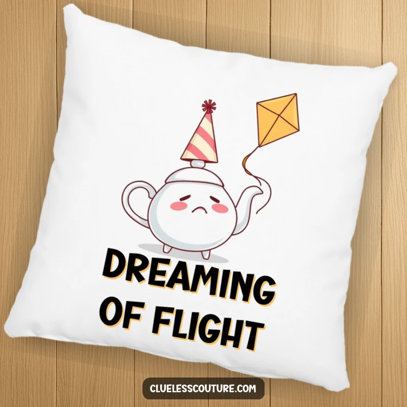 Funny pillow with a confused teapot wearing a party hat trying to fly a kite, offering comfort and a touch of lighthearted humor.
