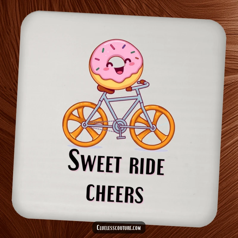 Funny coaster with a cheerful donut with sprinkles riding a pretzel bicycle, a whimsical drink accessory.