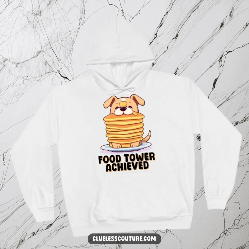 Funny hoodie featuring a dog focused on balancing a stack of pancakes on its nose, ideal for cozy wear.