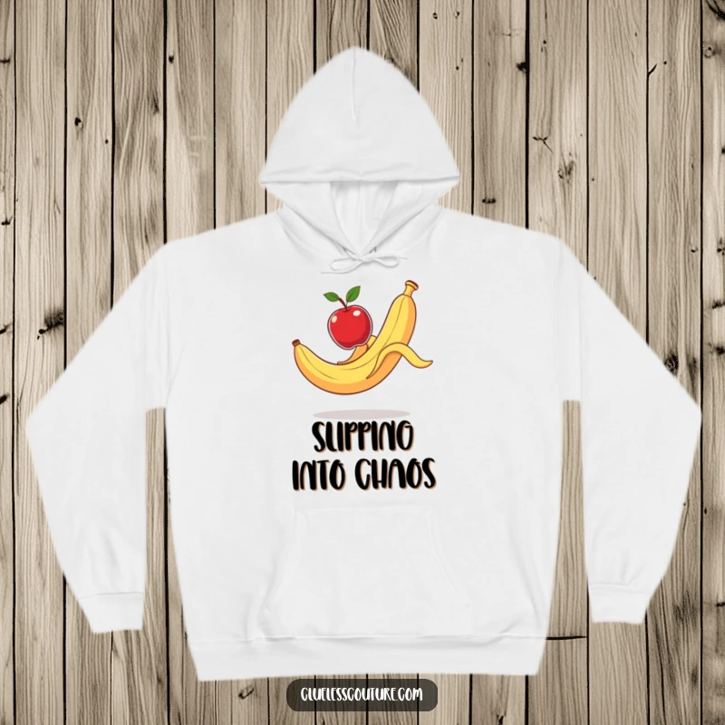 Funny Hoodie: A banana peel slips dramatically, launching an apple, showcasing a hilarious, cartoonish accident.