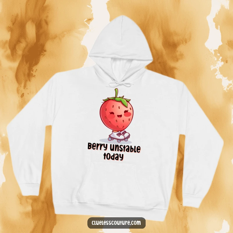 Funny hoodie featuring a blushing strawberry wearing tiny roller skates and wobbling uncontrollably, offering cozy and sweet vibes.