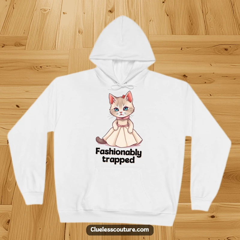 Funny hoodie featuring a cat struggling to fit into a miniature couture gown, ideal for cozy, fashionable humor.