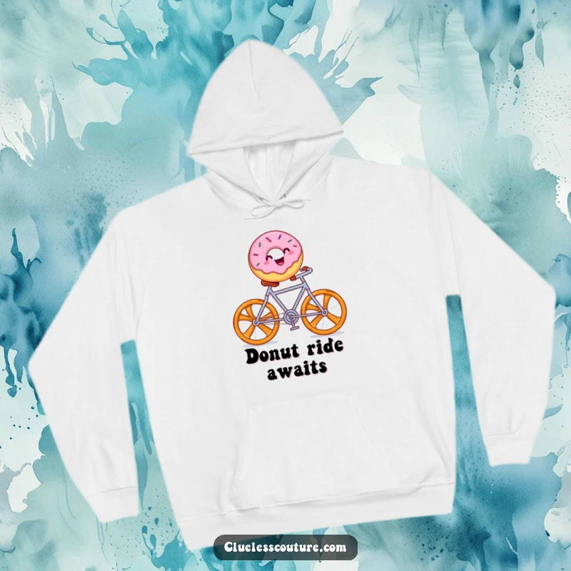Funny hoodie depicting a cheerful donut with sprinkles riding a pretzel bicycle, cozy and whimsical.
