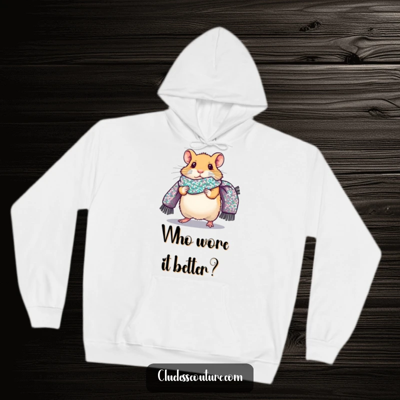 Funny hoodie featuring a nervous hamster confidently walking a fashion runway, accessorized with a giant sequined scarf, a cozy and humorous garment.