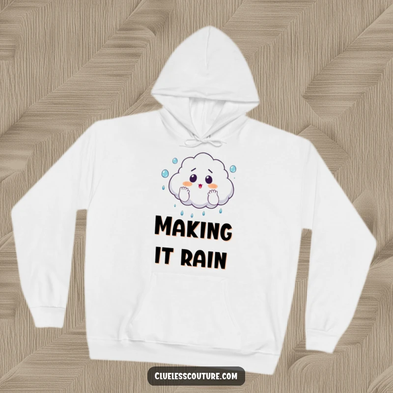 Funny hoodie featuring a surprised cloud comically juggling raindrops with its fluffy hands, offering cozy and whimsical vibes.