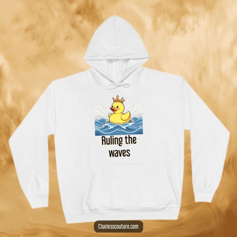 Funny hoodie showing a crowned rubber ducky sailing triumphantly through stormy seas, offering warmth and a humorous message of bravery.