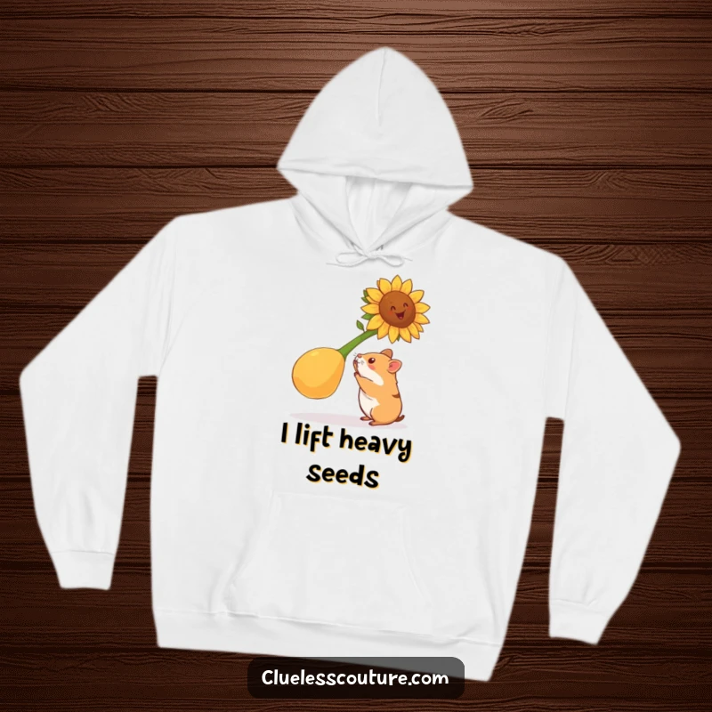 Funny hamster hoodie with a hamster attempting to lift a gigantic sunflower seed, offering cozy warmth and humorous workout motivation.