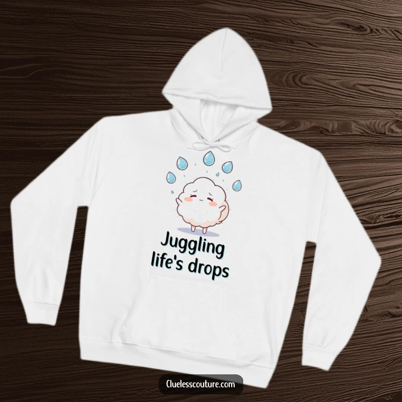 Funny hoodie featuring a fluffy cloud character humorously juggling raindrops and looking overwhelmed, offering comfort and shared experience.