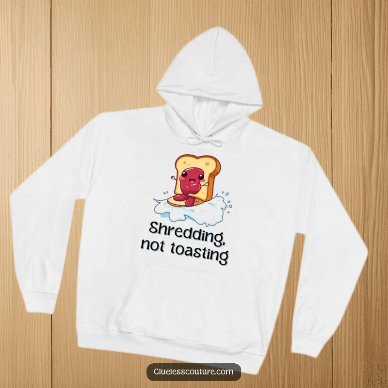 Funny hoodie depicting a piece of toast surfing on a wave of jam, a humorous and cozy breakfast theme.
