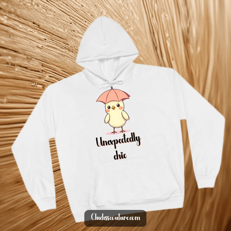 Funny hoodie print of a bird wearing a tiny umbrella as a hat, enjoying the bright sun, a silly sight.