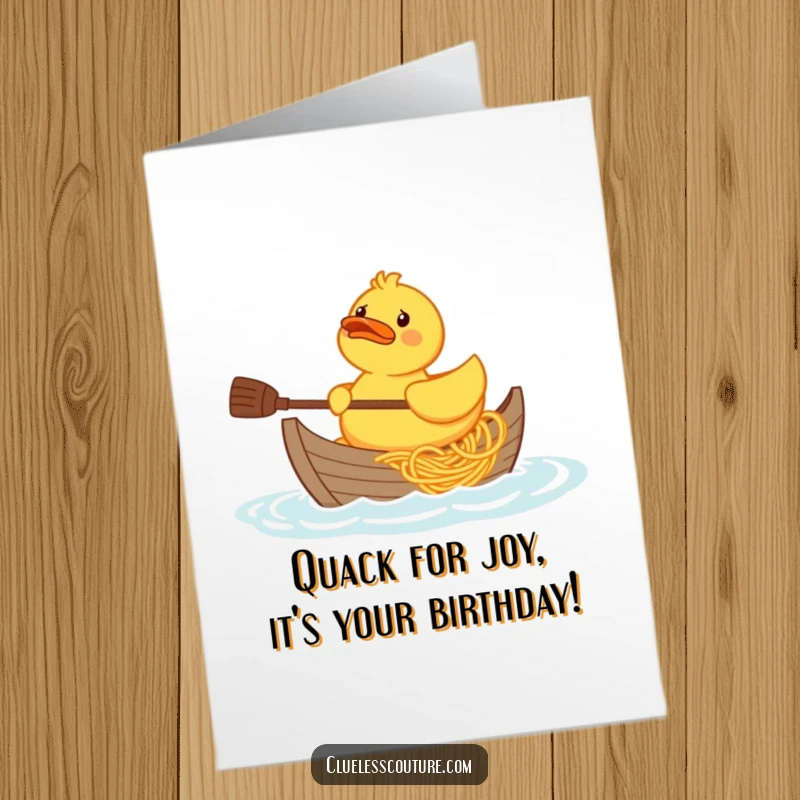 Funny Free Printable Birthday Card: A confused rubber duck struggles to paddle a boat made entirely of spaghetti.