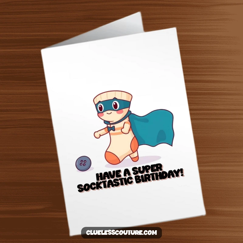 Funny free printable birthday card featuring a brave sock in a superhero cape rescuing a lost button, a charming rescue scene.
