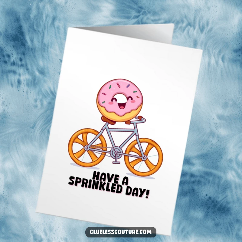 Funny Free Printable Birthday Card: Cheerful donut with sprinkles rides a pretzel bicycle.