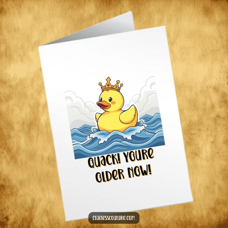 Funny Free Printable Birthday Card: Triumphant rubber ducky in a crown floats regally on stormy seas, a humorous birthday wish.