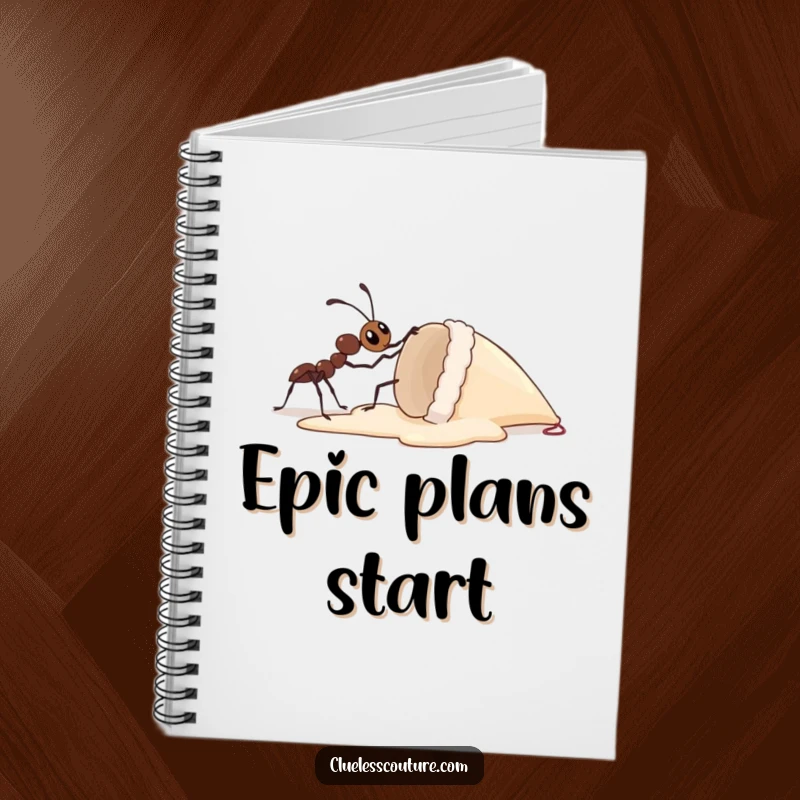 Funny notebook cover art of a curious ant trying to lift an enormous ice cream cone, suggesting big dreams and humorous effort.