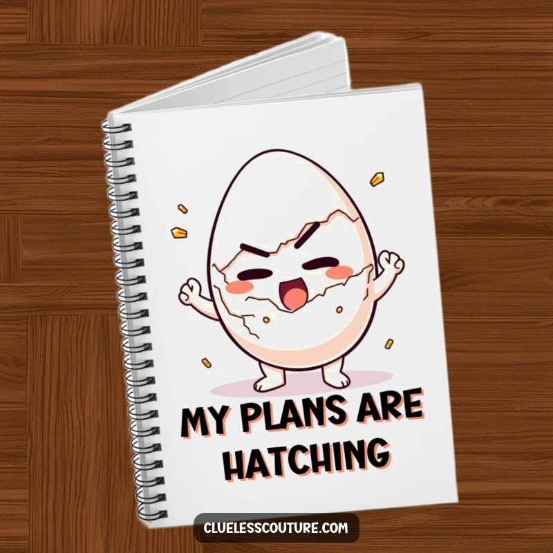 Funny notebook with a determined egg character struggling to crack itself open, perfect for jotting down breakfast plans.