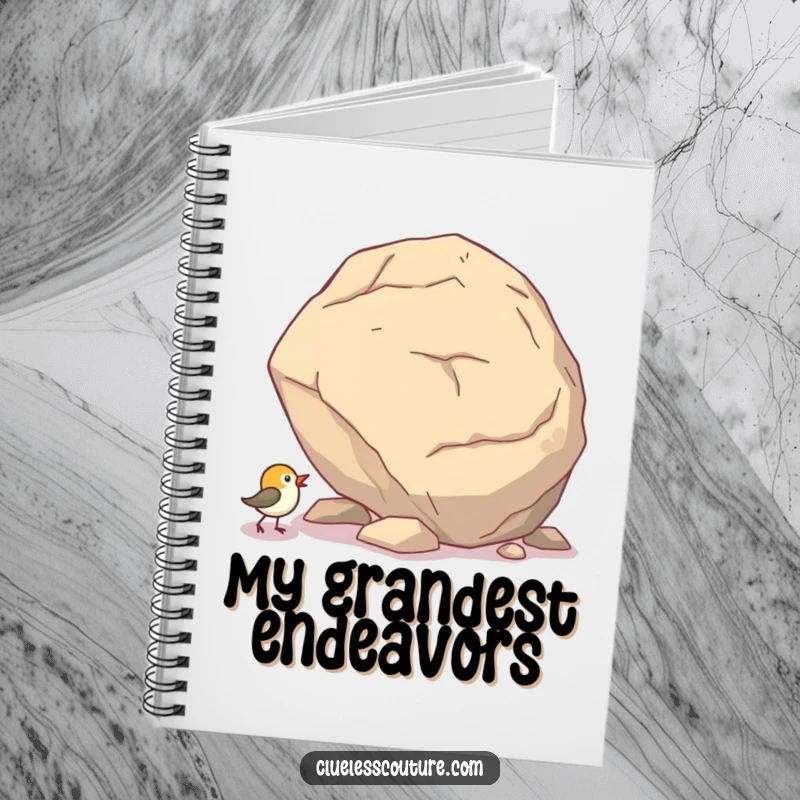 Funny notebook cover with a small bird comically pushing a giant boulder uphill, inspiring perseverance.
