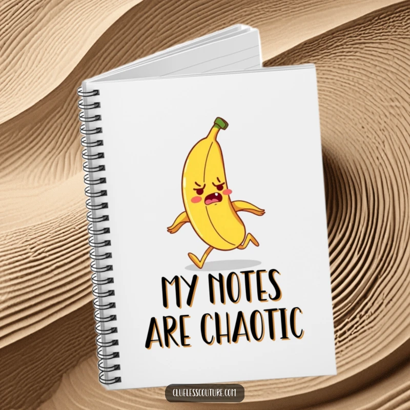 Funny banana character tripping over its peel while running, a humorous notebook for jotting down ideas.