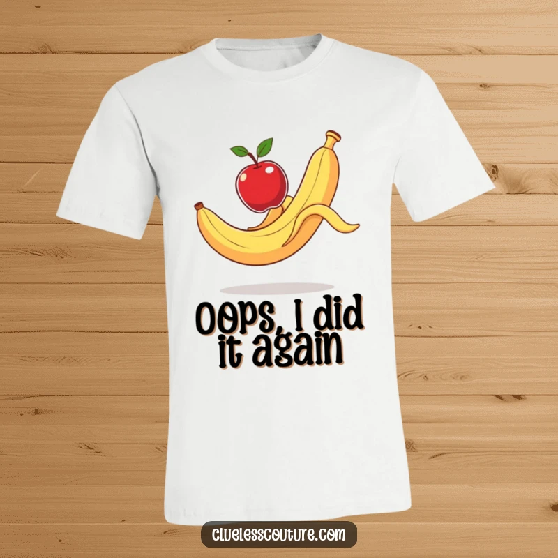 Funny T-Shirt: A banana peel comically slips, sending an apple flying, capturing a moment of slapstick humor.