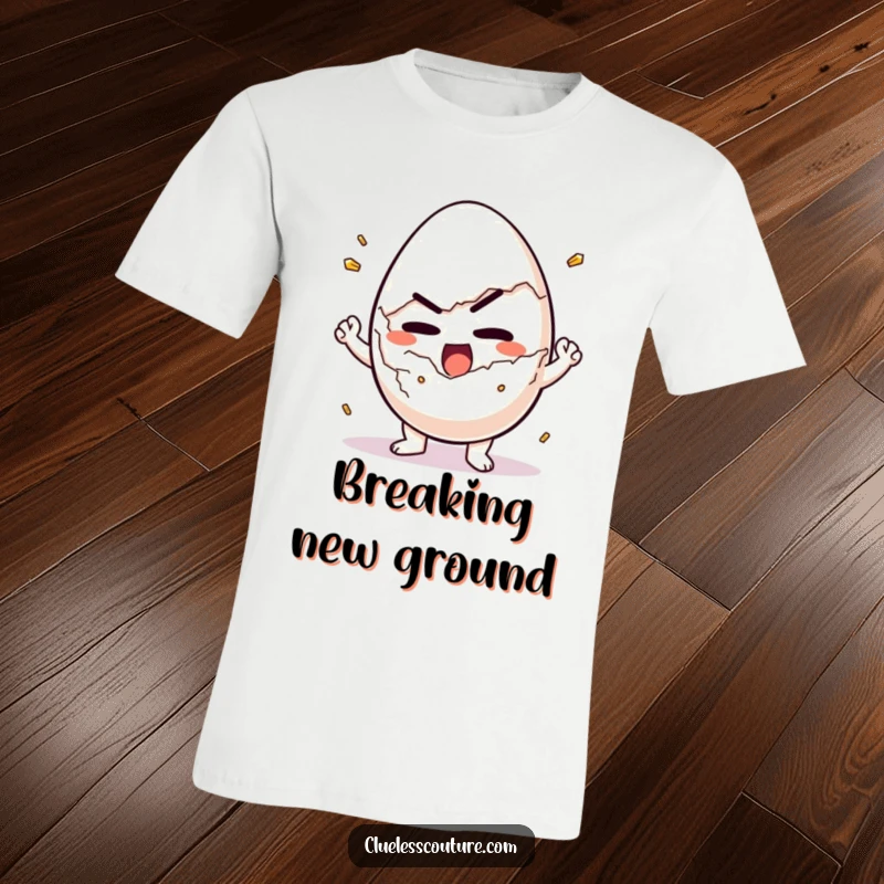 Funny t-shirt depicting a determined egg character making a valiant effort to crack itself open for breakfast.