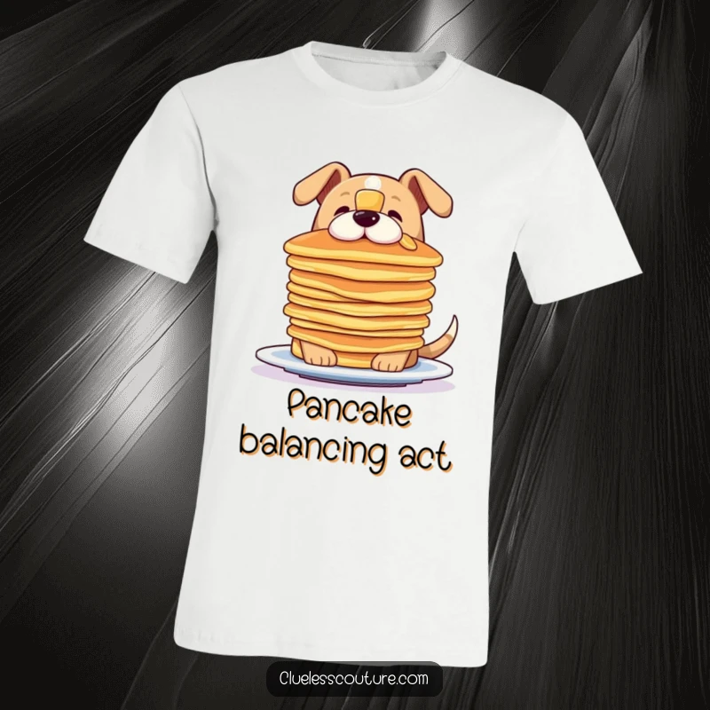 Funny t-shirt depicting a dog concentrating hard while trying to balance a precarious stack of pancakes on its snout.