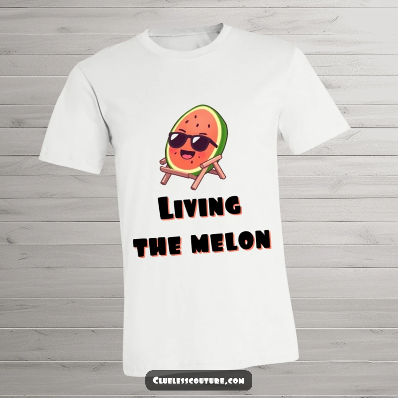 Funny t-shirt with a laughing watermelon slice wearing cool sunglasses, lounging on a tiny beach chair, radiating summer joy.