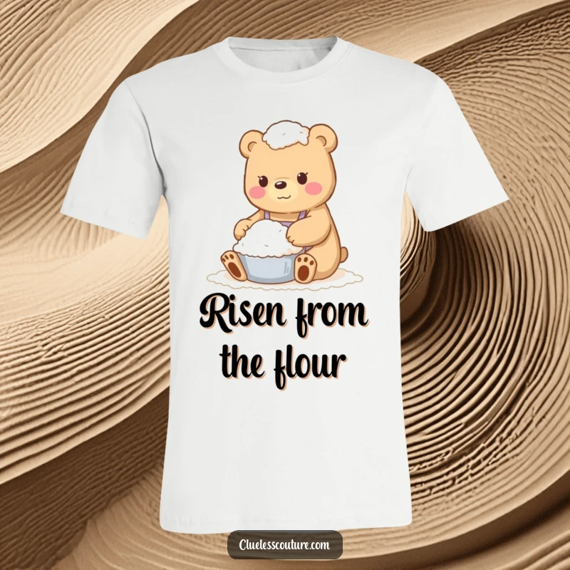 Funny t-shirt print of a bear completely engulfed in flour during a baking attempt, looking comically overwhelmed.