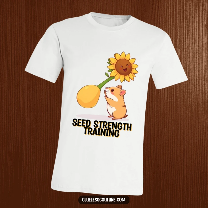 Funny hamster t-shirt featuring a determined hamster attempting to lift a gigantic sunflower seed, showcasing strength, perseverance, and humorous effort.
