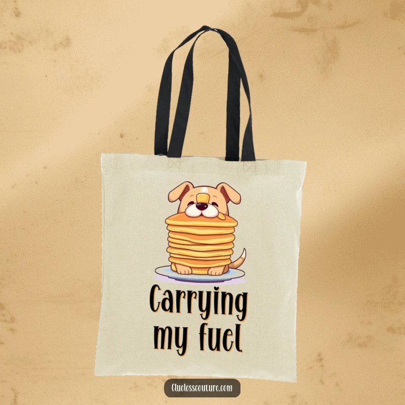 Funny tote bag illustrating a dog's determined effort to balance a stack of pancakes perfectly on its nose.