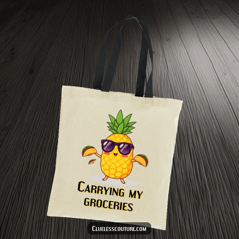 Funny pineapple with sunglasses juggling tiny tacos on a sturdy tote bag for shopping or beach trips.