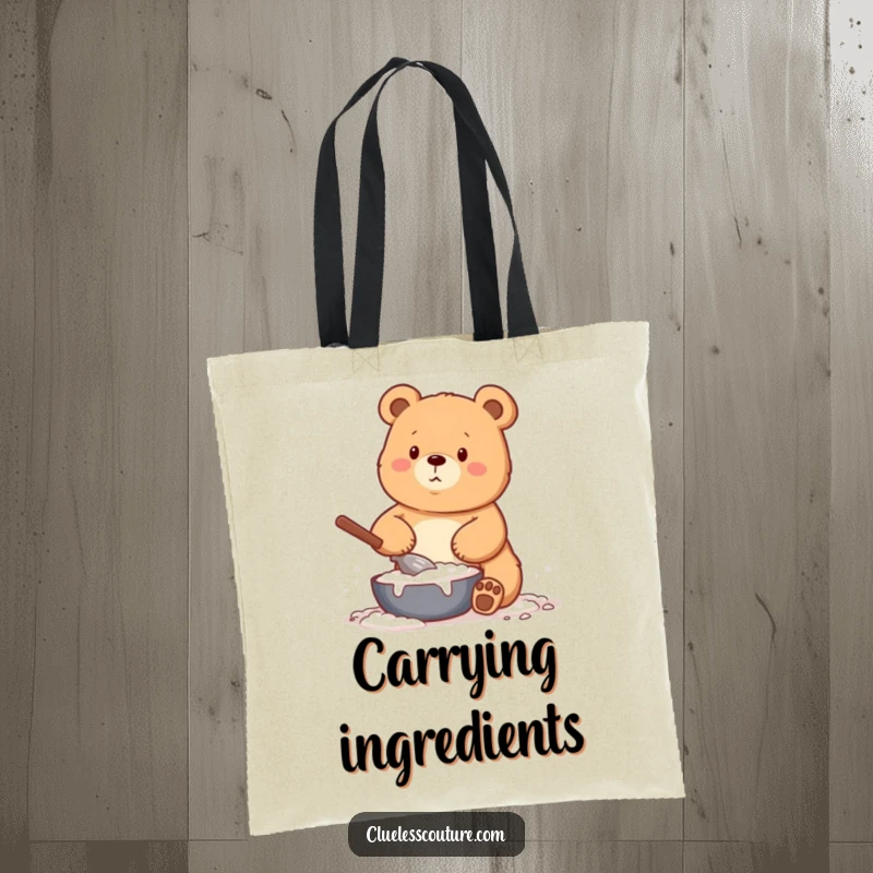 Funny tote bag showcasing a bear humorously covered in flour while baking, a practical and amusing accessory for kitchen enthusiasts.