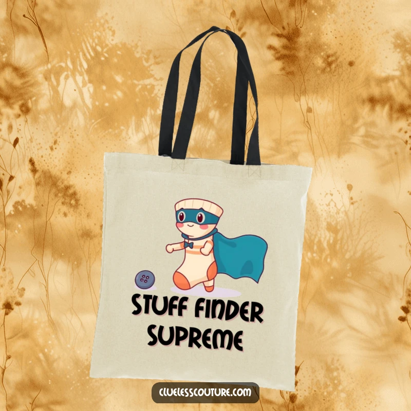 Funny tote bag design showing a brave sock in a cape rescuing a lost button, perfect for carrying essentials with a heroic theme.